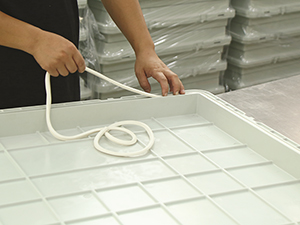 Rubber strip inserting